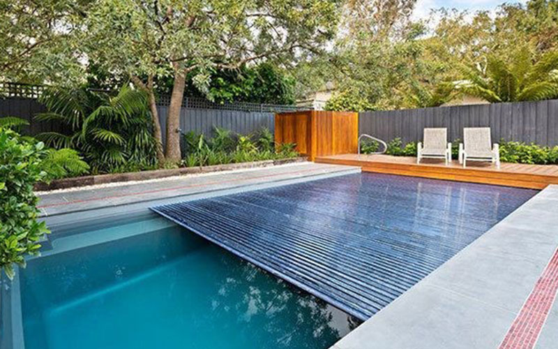 removing trees near a pool with a cover in Melbourne